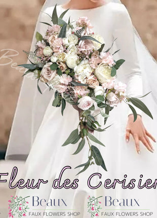 Cascading white pink silk flower Bridal Bouquet Held by bride