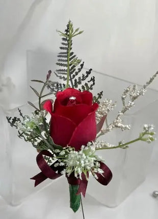 Gents, guest buttonhole with dark Red Rose bud and fern foliage Beaux Faux Flowers Shop
