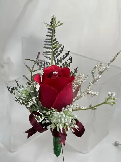 Gents, guest buttonhole with dark Red Rose bud and fern foliage Beaux Faux Flowers Shop