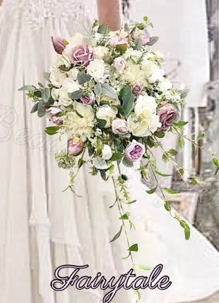 Floral arrangement held by a person with 'Fairytale' branding.