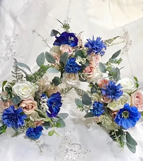 Floral arch with blue and pink flowers on a white background