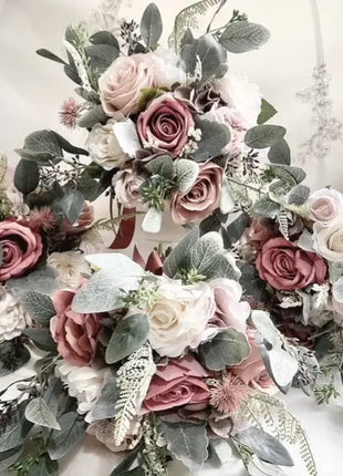 Floral wreath with pink, white, and green flowers on a white background