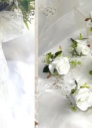 Bouquet with white ribbon and floral corsages on a white background