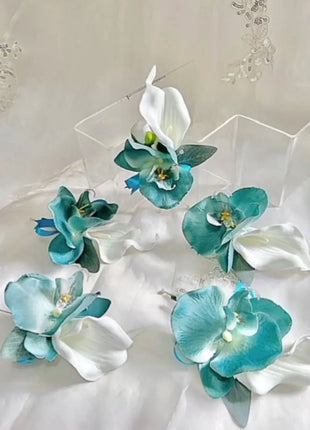 Set of turquoise and white floral hair accessories on a white background