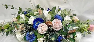 Bouquet of flowers with blue and pink flowers on a white background