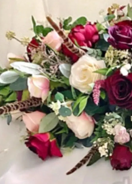 Scottish Table Arrangement with roses pheasant feather In burgundy Beaux Faux Flowers Shop