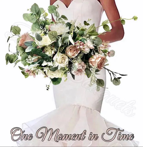 Bouquet of flowers held by a person wearing a white dress with 'One Moment in Time' text.