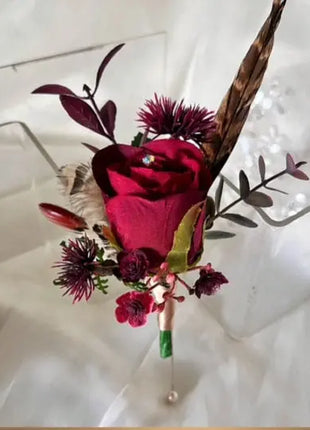 Gents, guest buttonhole, ruby red Rose with pheasant feather detail Beaux Faux Flowers Shop