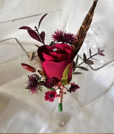 Gents, guest buttonhole, ruby red Rose with pheasant feather detail Beaux Faux Flowers Shop