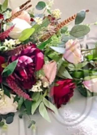 Scottish Table Arrangement with roses pheasant feather In burgundy Beaux Faux Flowers Shop