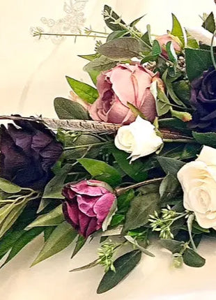 Scottish Table Arrangement with roses pheasant feather In plum Beaux Faux Flowers Shop