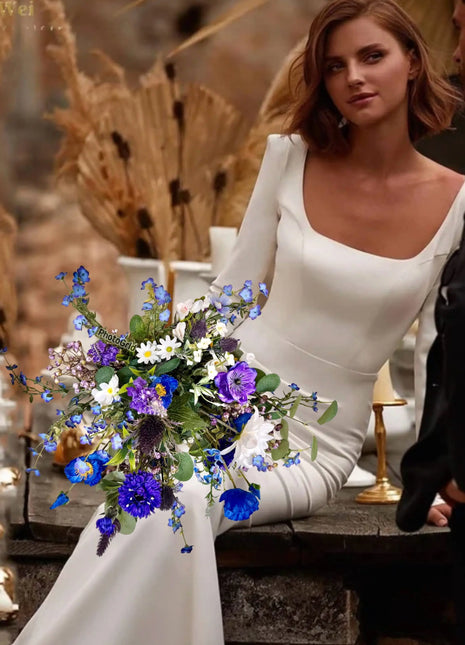Scottish wildflowers, thistle  Bridal Bouquet Wedding Flowers blues purples In brides hands